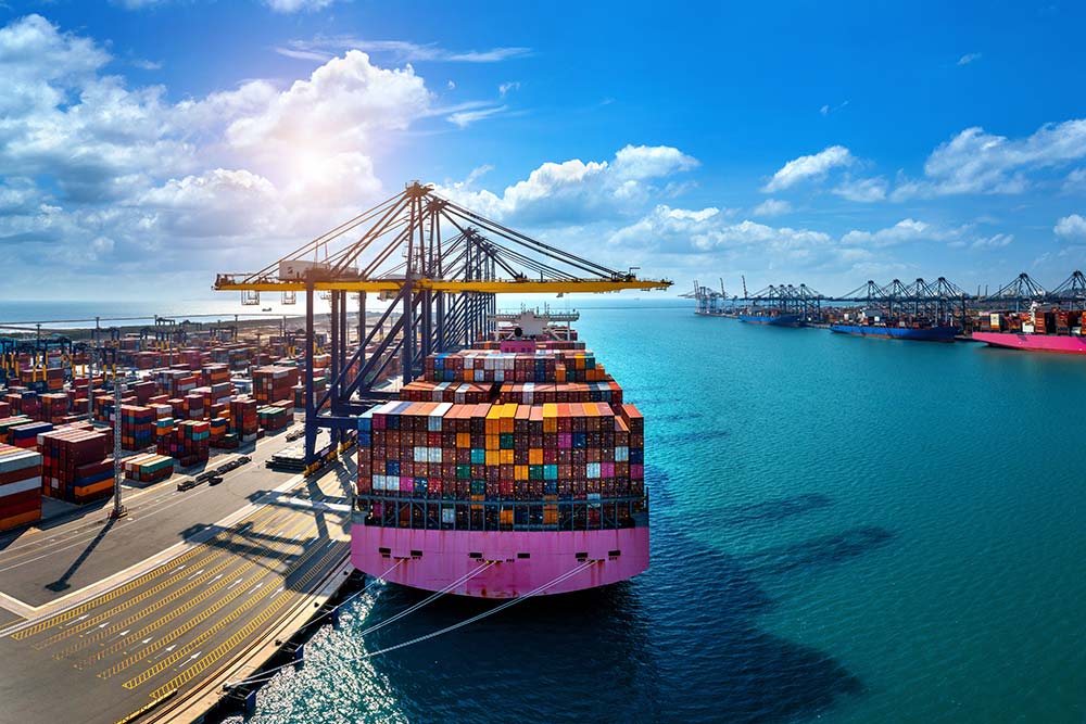 Cargo ship and shipping containers at port