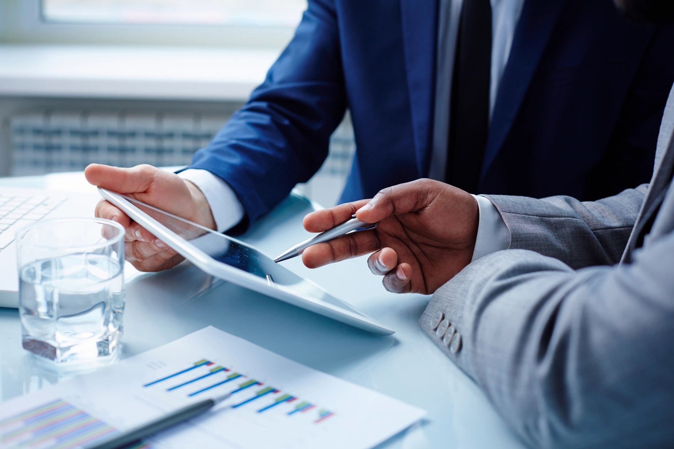 Business advisers reviewing financial charts